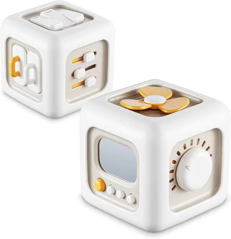 Two white toy cubes with various buttons and features on a white background